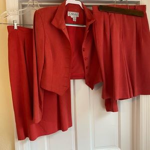 Three piece suit jacket, sport shorts and skirt.